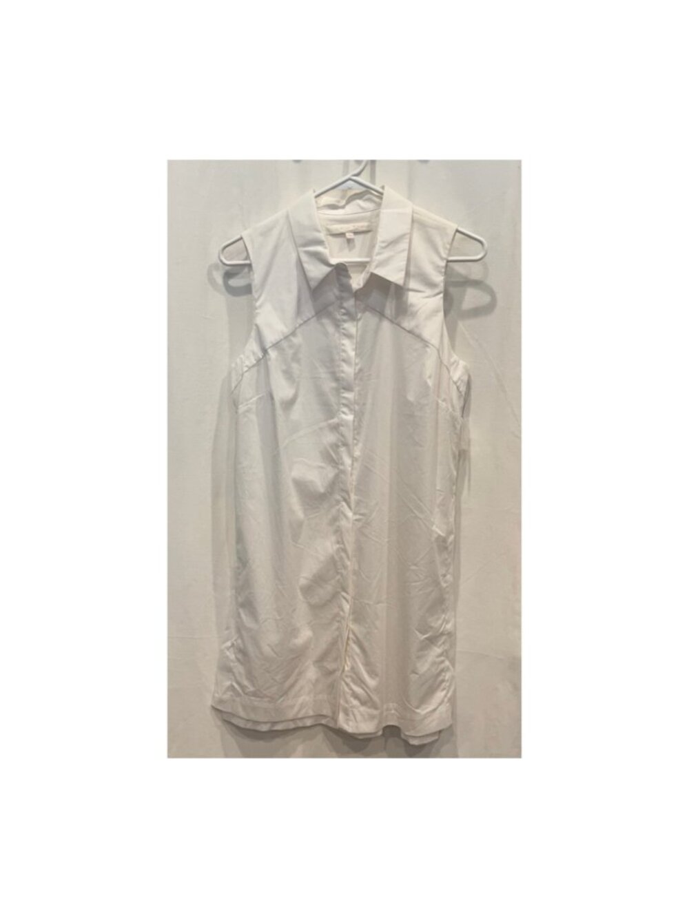 White Sleeveless Button-Up Blouse